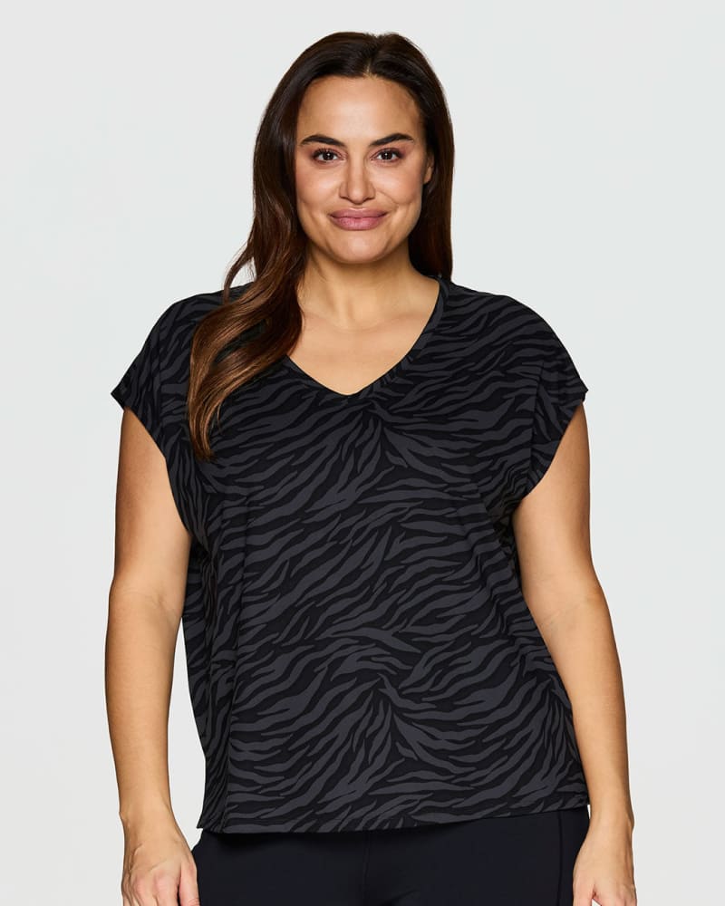 Front of a model wearing a size 1X Super Soft Zebra Tee in Black by RBX Active. | dia_product_style_image_id:244744